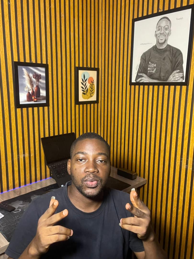 Joseph Kazeem talking to camera in the studio